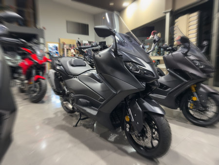 new black motorcycles in motorcycle showroom, blur effectの写真素材