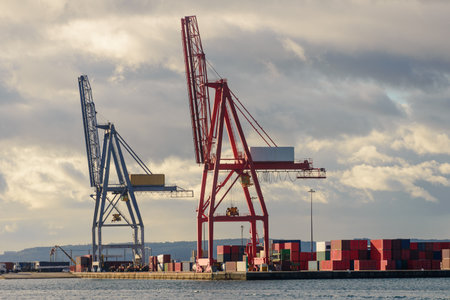 Port crane in a seaport, industry, cargo transportationの写真素材