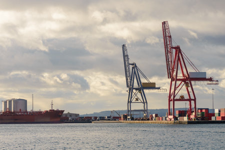 Port crane in a seaport, industry, cargo transportationの写真素材