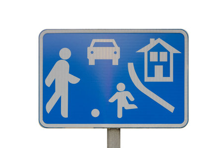 A blue sign residential area with a person walking, a car, a house, and a child playing with a ball isolated on white backgroundの写真素材
