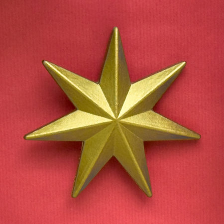 golden Christmas star on a red background