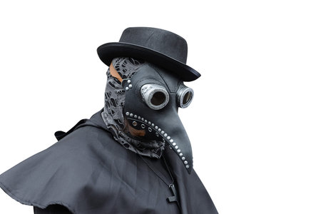 A man in a black medieval medical plague mask isolated on white background