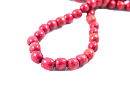 red beads on white background,decoration, pearl, jewelry, bead, bright, ornamentの写真素材