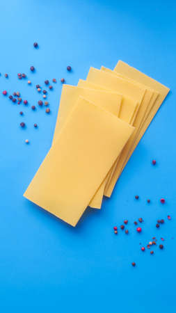 Lasagna sheets on a blue backgroundの写真素材