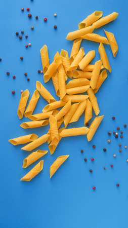Garganelli pasta on a blue backgroundの写真素材