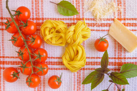Tagliatelle together with ingredients for pastaの写真素材