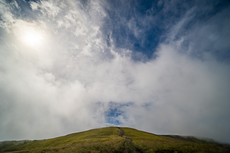Landscape of Borzhava ridge of the Ukrainian Carpathian Mountains. Clouds above Carpathiansの写真素材