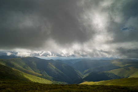 Rain clouds above Carpathians. Panorama of Borzhava Ridge of the Ukrainian Carpathian Mountainsの写真素材