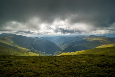 Rain clouds above Carpathians. Panorama of Borzhava ridge of the Ukrainian Carpathian Mountainsの写真素材