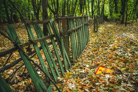 Radiation Sign - triangular warning yellow sign of radiation hazard in the zone of radioactive fallout in Pripyat city. Chernobyl exclusion zoneの写真素材