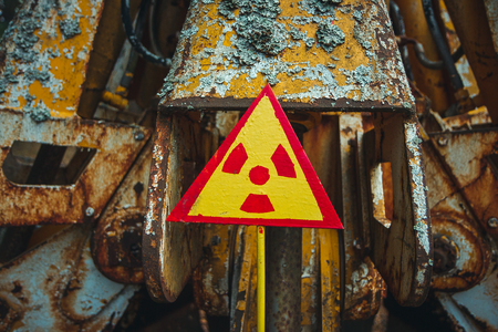 Radiation Sign - triangular warning yellow sign of radiation hazard in the zone of radioactive fallout in Pripyat city. Chernobyl exclusion zoneの写真素材