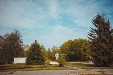 Monument to Lenin in Chornobyl exclusion zone. Radioactive zone in Pripyat city - abandoned ghost town. Chernobyl history of catastrophe. Lost place in Ukraine, USSRの写真素材