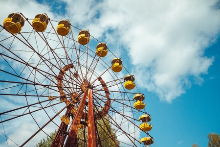 Abandoned amusement park in the city center of Prypiat in Chornobyl exclusion zone. Radioactive zone in Pripyat city - abandoned ghost town. Chernobyl history of catastropheの写真素材