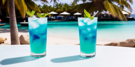 A blue cocktail in a glass on a white table against the background of a sea beach on a bright sunny day under palm trees. Generative AIの素材