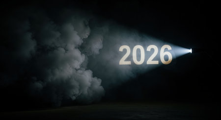 The significant numbers 2026 are prominently highlighted by a strong, focused light beam emerging from the right, surrounded by dense, dark smoke and a shadowy floor.の素材