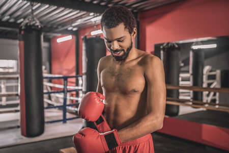 African american kickboxer having a workout in a gym and looking concentratedの写真素材