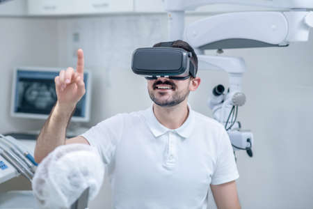 Picture of a doctor in vr glasses looking involvedの写真素材