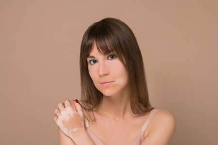 A young pretty long-haired woman with skin pigmentation
