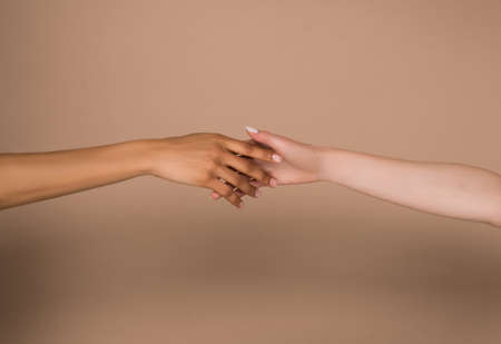 A close up picture of female clasped handsの写真素材