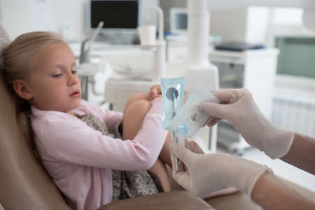 Pediadontist working with a snall patient in the clinicの写真素材