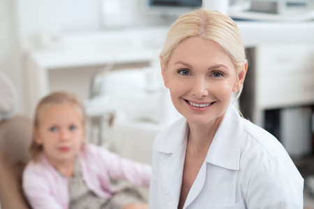 A little girl visiting dentist and feeling excitedの写真素材