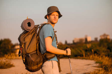 A male hiker enjoying view of nature from the hillの写真素材