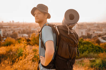 A picture of a young man with a backpack going hiking