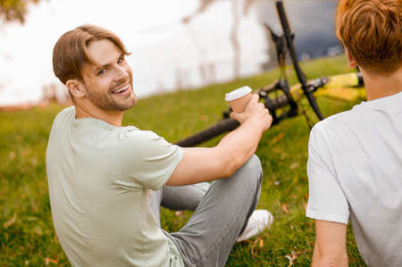 Two sporty guys resting after the cycling workoutの写真素材