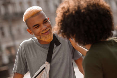 A couple in the city street looking positiveの写真素材