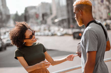 A young man and a woman in the street enjoying the dayの写真素材