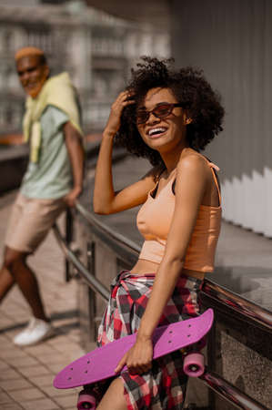 Young dark-skinned couple enjoying the day togetherの写真素材