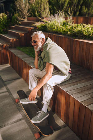 Muscular Caucasian man enjoying his outdoor restの写真素材