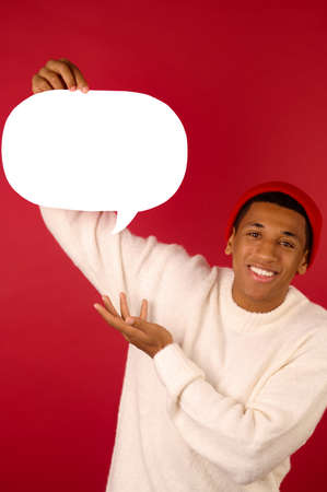 A young man in santa hat holding emojiの写真素材