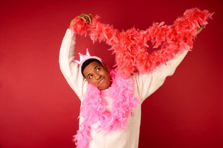 A dark-skinned man getting dressed for the new year party