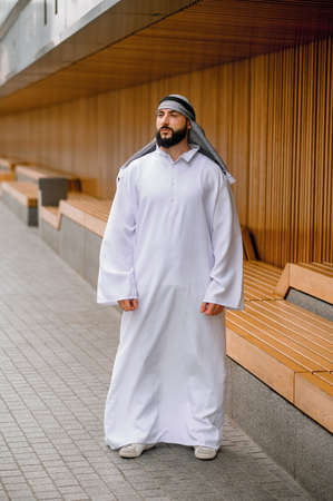 Middle eastern young man in traditional clothingの写真素材