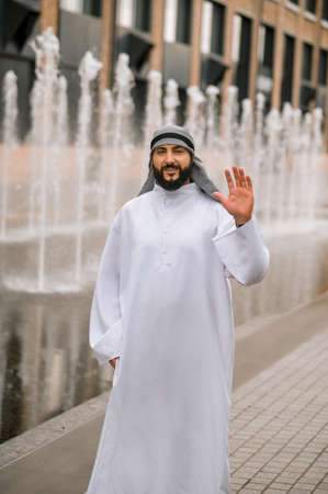 Arabian man in orient traditional clothing in the steertの写真素材