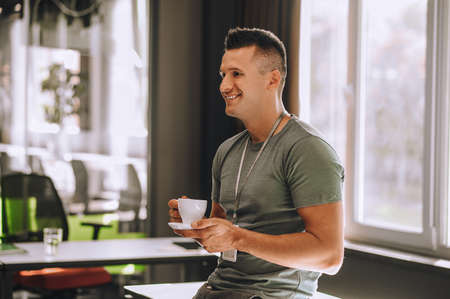 Office worker having coffee while coffee break