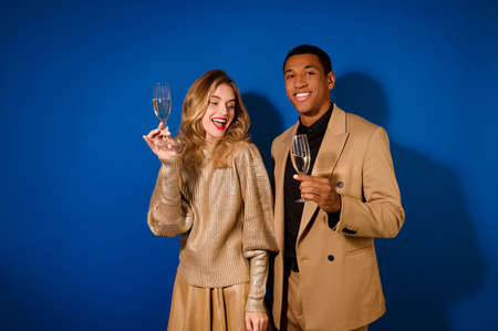 Guy and girl with glasses of champagneの写真素材