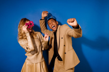 Enthusiastic energetic guy and girl with maskの写真素材
