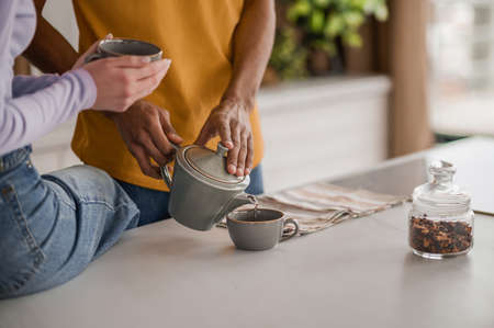 Happy young couple in the kitchenの写真素材