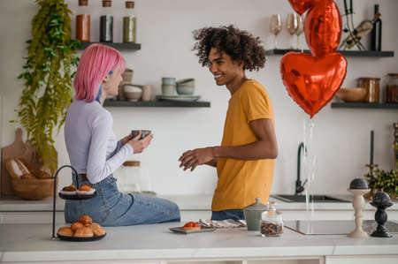 Happy young couple in the kitchenの写真素材