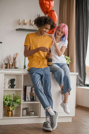 Young couple in the kitchen feeling happy and excitedの写真素材