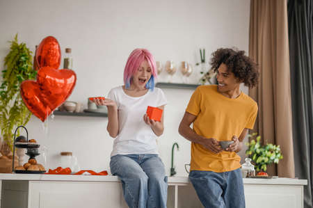 Young couple in the kitchen feeling happy and excitedの写真素材