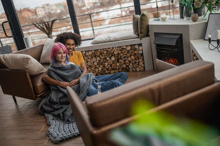 Two young people feeling comfortable and peaceful togetherの写真素材