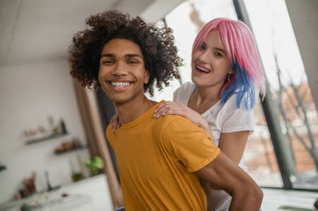 Young people having fun together at home and looking happyの写真素材