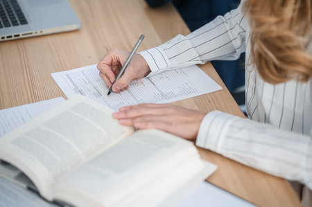 Close up of a woman writing somethingの写真素材