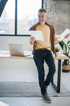 A man in casual clothes working in the officeの写真素材