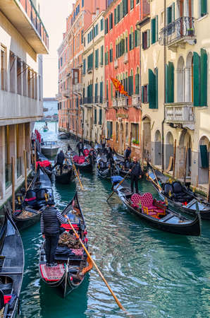Crowding of gondola in a narrow street of Venice, Italyの写真素材