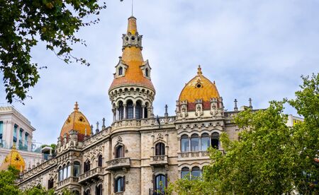 Cases Antoni Rocamora building with orange roofs in Barcelona, summer Spainの写真素材