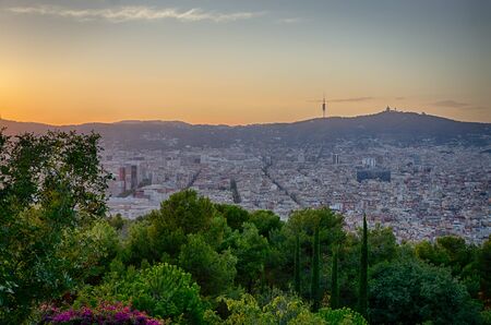 Warm orange sunset over Barcelona city, summer Spainの写真素材